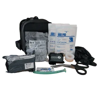 Tactical first aid kit with trauma bandages, tourniquet, and medical supplies for military or law enforcement use